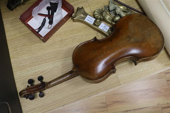 A violin, bow and a mother of pearl inlaid mandolin